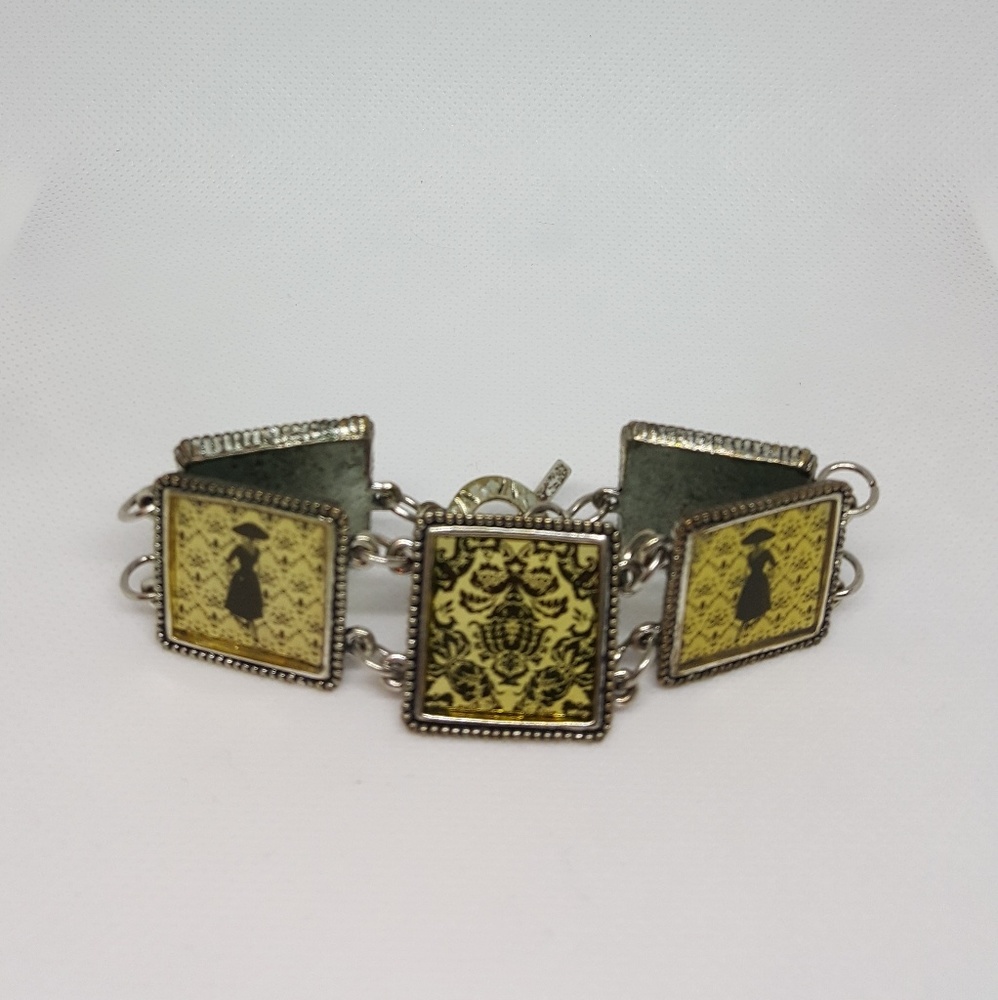 Silvertone charm bracelet with framed pictures